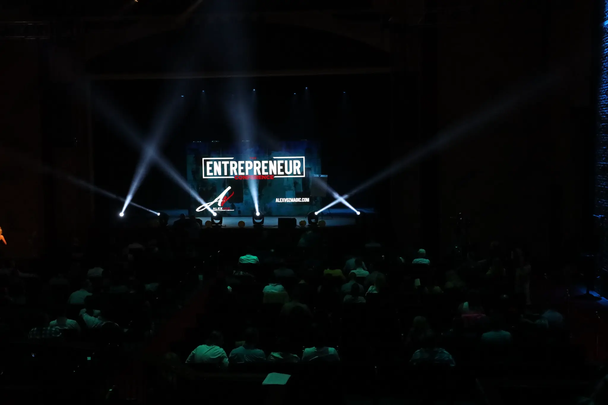The Entrepreneur Conference venue with stage lights and audience